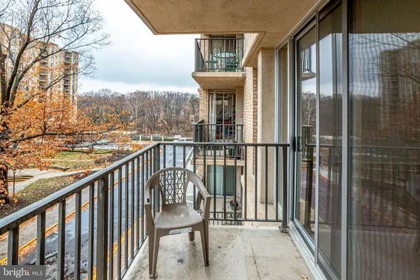 a view of a balcony with furniture