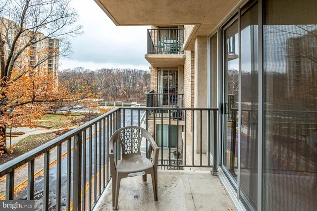 a view of a balcony with furniture