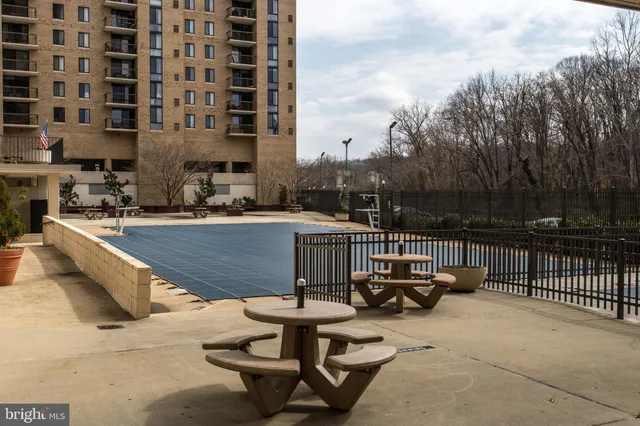 a view of a swimming pool with chairs