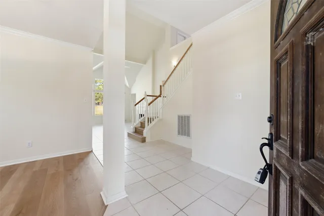 a view of an entryway with wooden floor