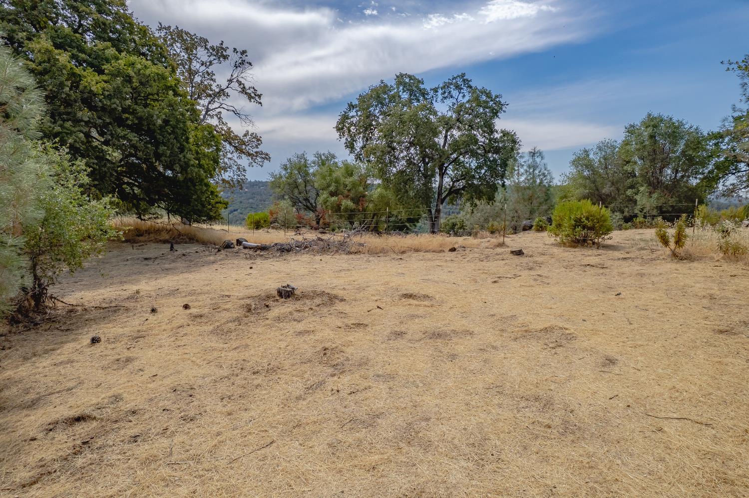 14331 Beitler Road Nevada City, CA 95959 - Photo 13 of 36 a view of a dirt road with a building in the background