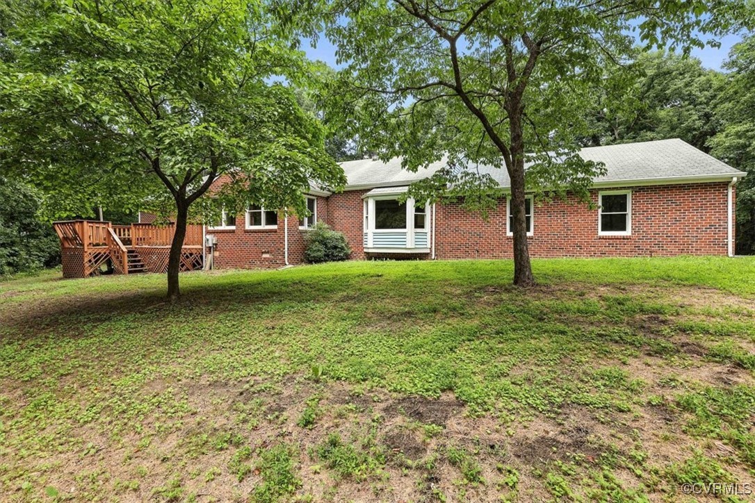5552 Quail Ridge Terrace Chesterfield, VA 23832 - Photo 25 of 32 a backyard of a house with lots of green space
