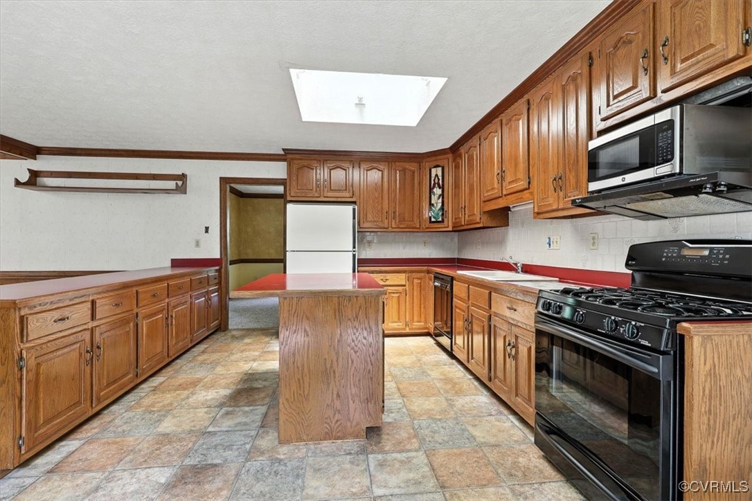 5552 Quail Ridge Terrace Chesterfield, VA 23832 - Photo 7 of 32 a kitchen with stainless steel appliances granite countertop a stove a sink dishwasher and a microwave oven with cabinets