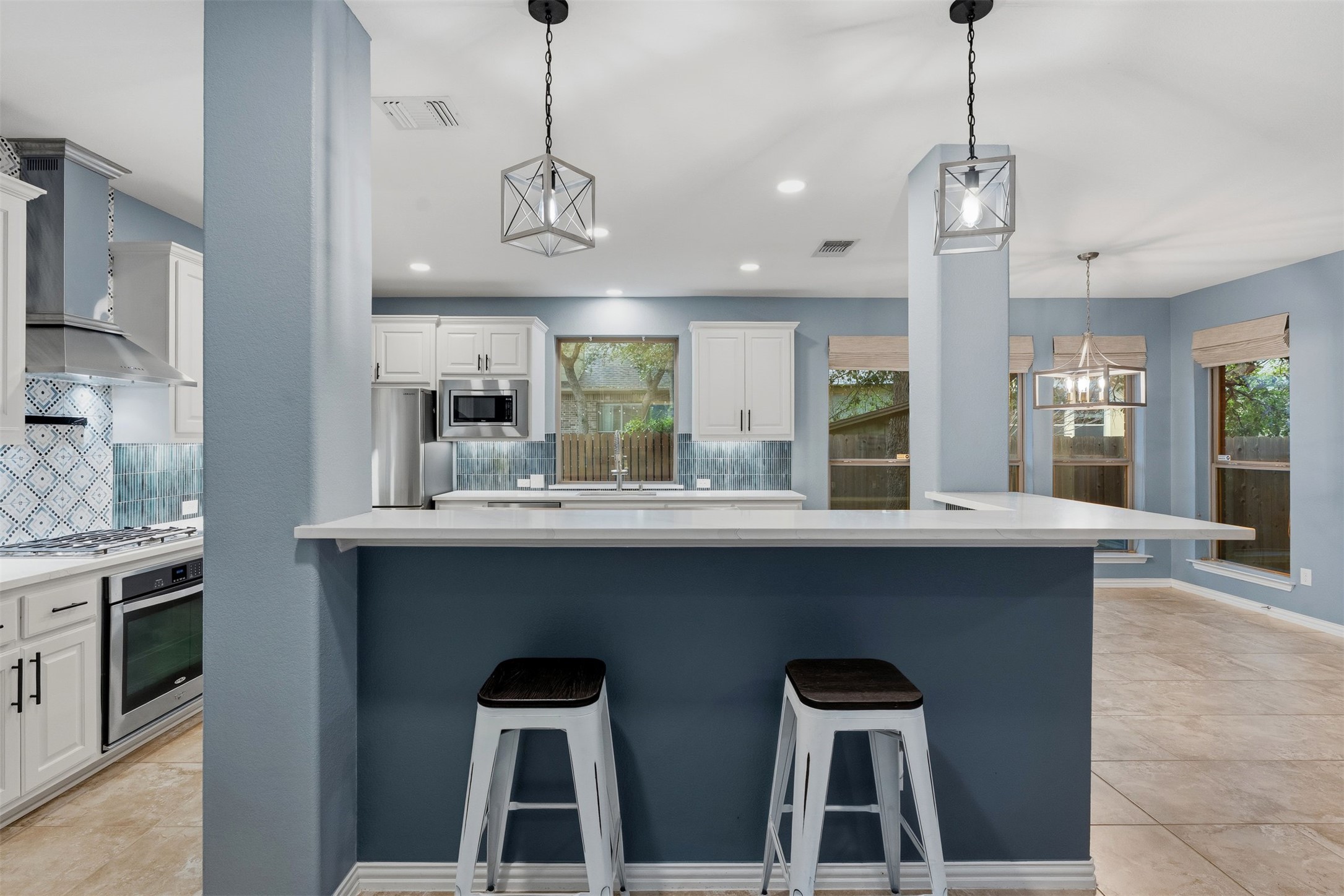 3935 Bowstring Bend Cedar Park, TX 78613 - Photo 16 of 39 The extended island countertop creates a natural breakfast bar, offering a relaxed spot for quick bites or chatting with the cook.