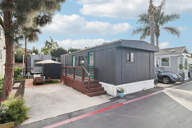 a view of a car park in front of house