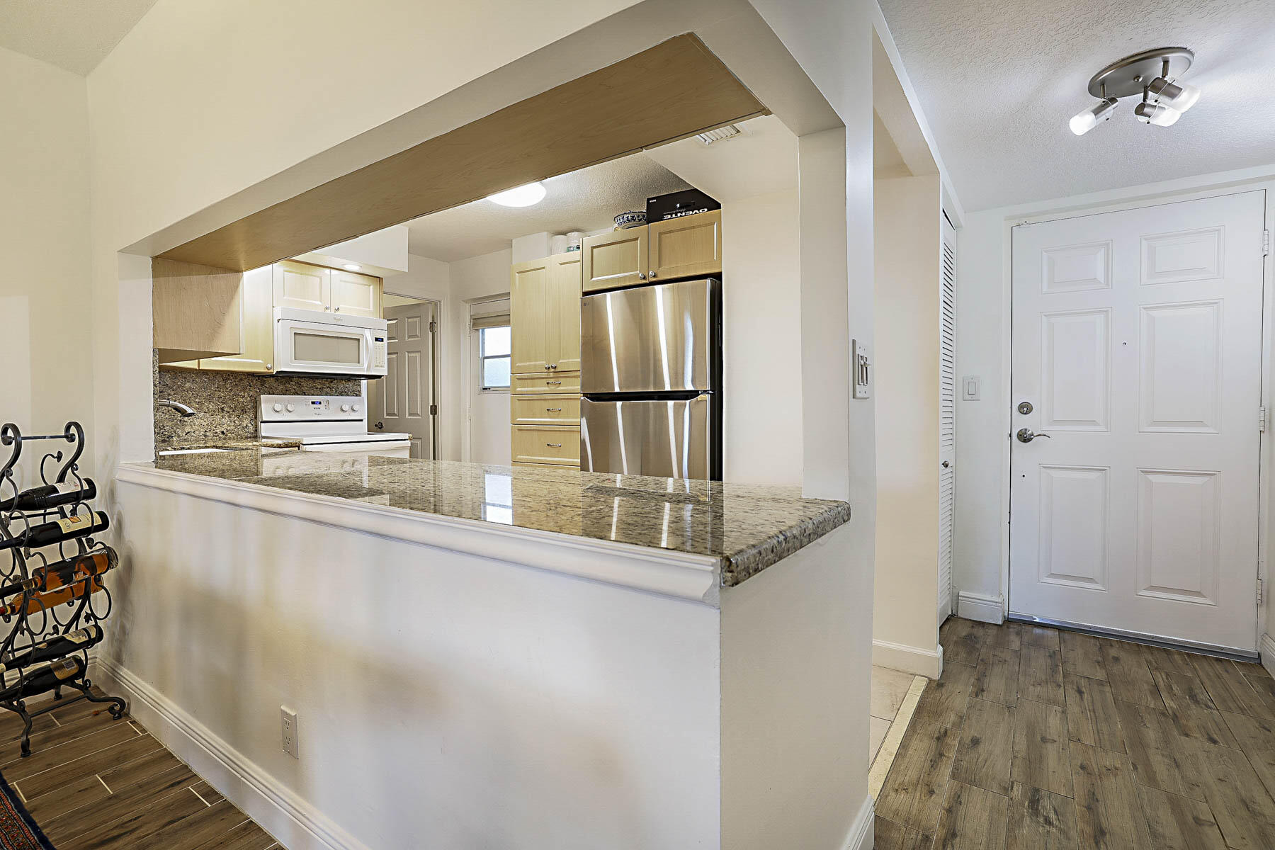 250 Northwest 67th Street, Unit 119 Boca Raton, FL 33487 - Photo 11 of 30 Kitchen and entrance