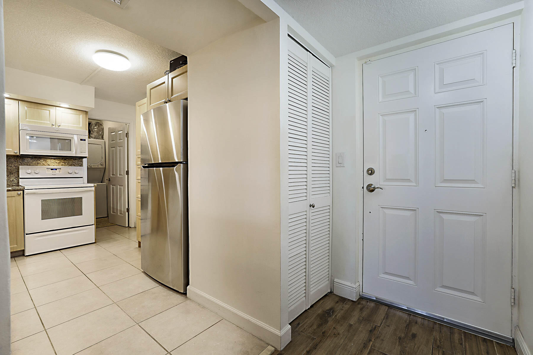 250 Northwest 67th Street, Unit 119 Boca Raton, FL 33487 - Photo 14 of 30 Kitchen and entrance
