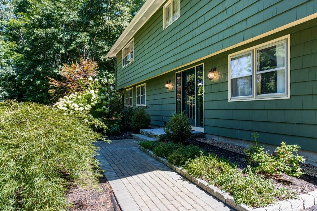 336 Taylor Road Stow, MA 01775 - Photo 4 of 37 a view of a backyard with plants