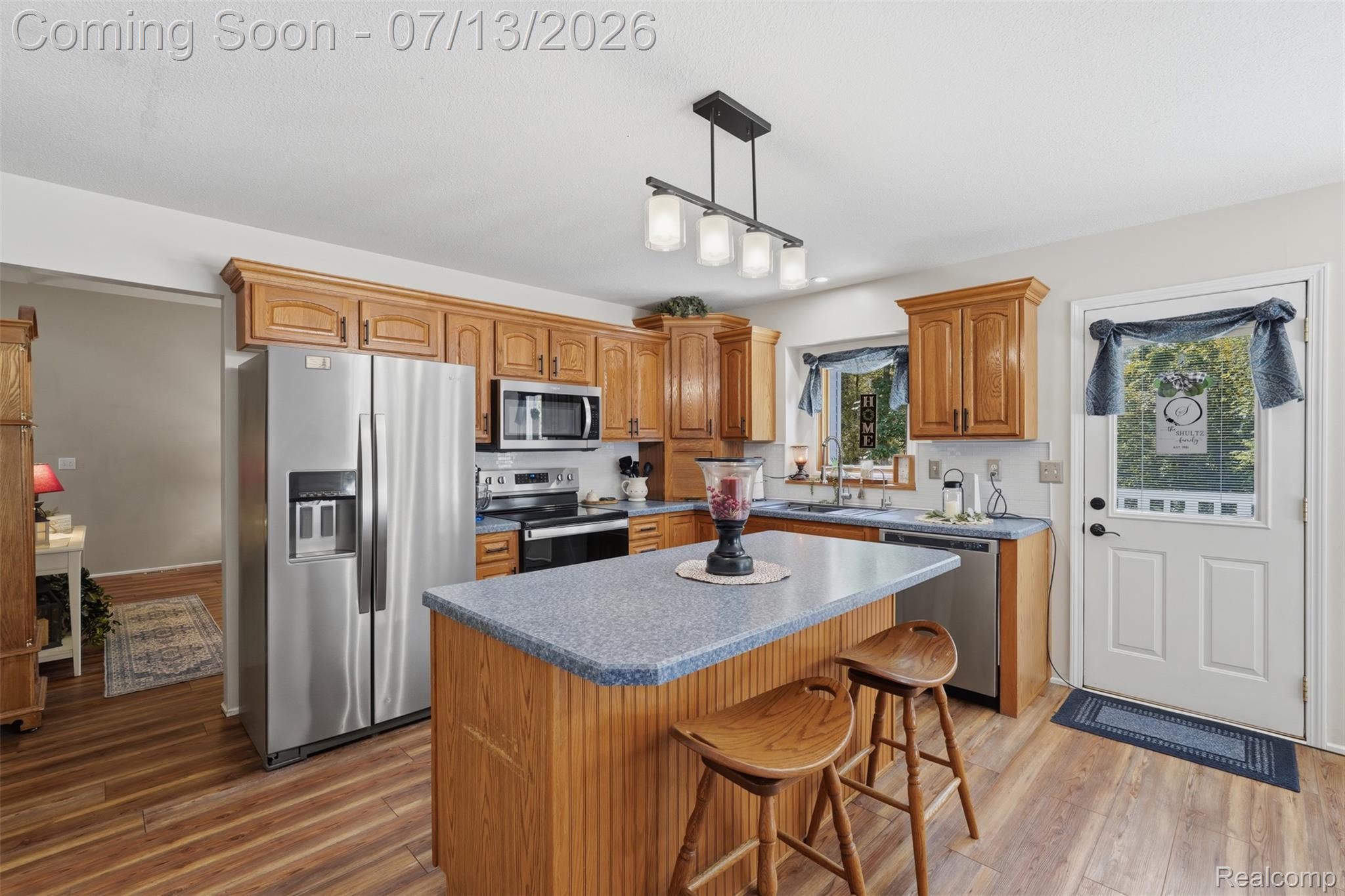 10525 Antcliff Road Brooklyn, MI 49230 - Photo 13 of 80 Kitchen featuring new laminate flooring and panoramic views from the wraparound porch