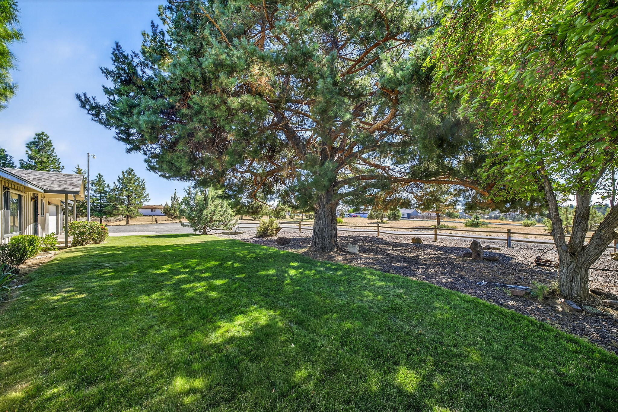 951 Southeast Rancho Lane Madras, OR 97741 - Photo 25 of 48 Landscape (Front) - Mature shade trees