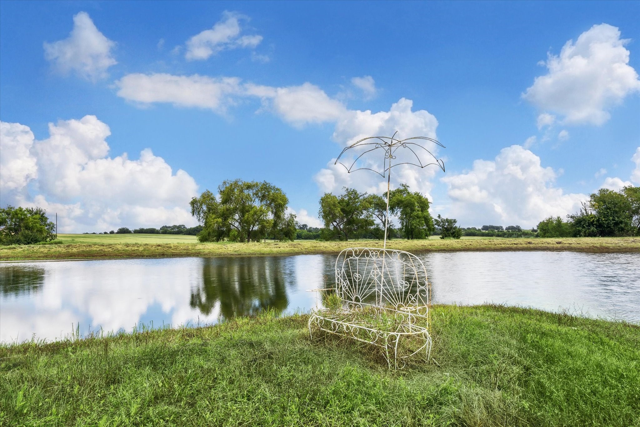 230 Vineyard View Trail Carmine, TX 78932 - Photo 10 of 12 a view of a lake from a yard