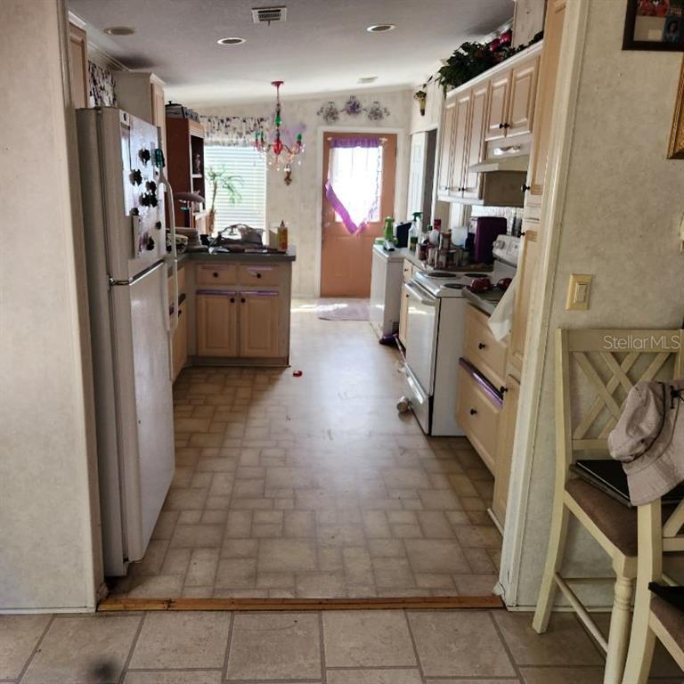 114 Singleton Avenue Arcadia, FL 34266 - Photo 2 of 9 a kitchen with stainless steel appliances a refrigerator and a stove