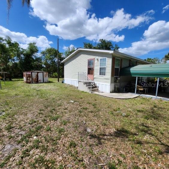 114 Singleton Avenue Arcadia, FL 34266 - Photo 7 of 9 a view of a house with a yard and sitting area