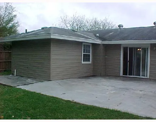 a backyard of a house with large trees