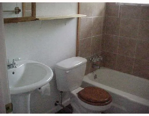 a bathroom with a sink a toilet and a bathtub