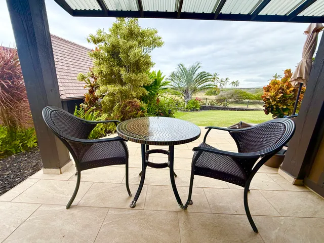 a view of a chairs and table on the terrace