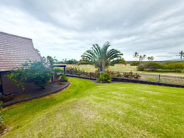 a view of a swimming pool and an outdoor seating