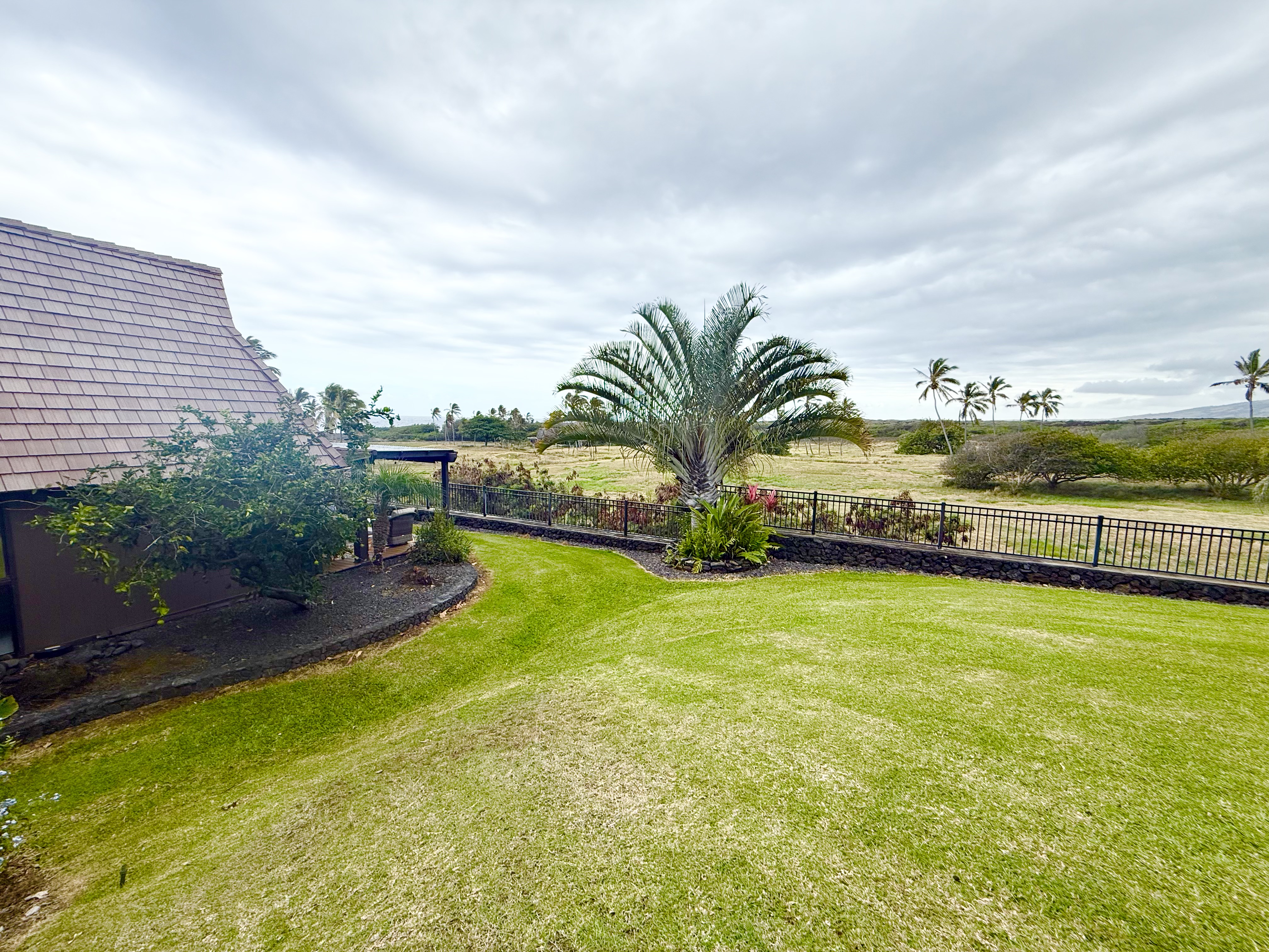 95-788 Ninole Loop Road, Unit 39 Naalehu, HI 96772 - Photo 14 of 15 a view of a swimming pool and an outdoor seating