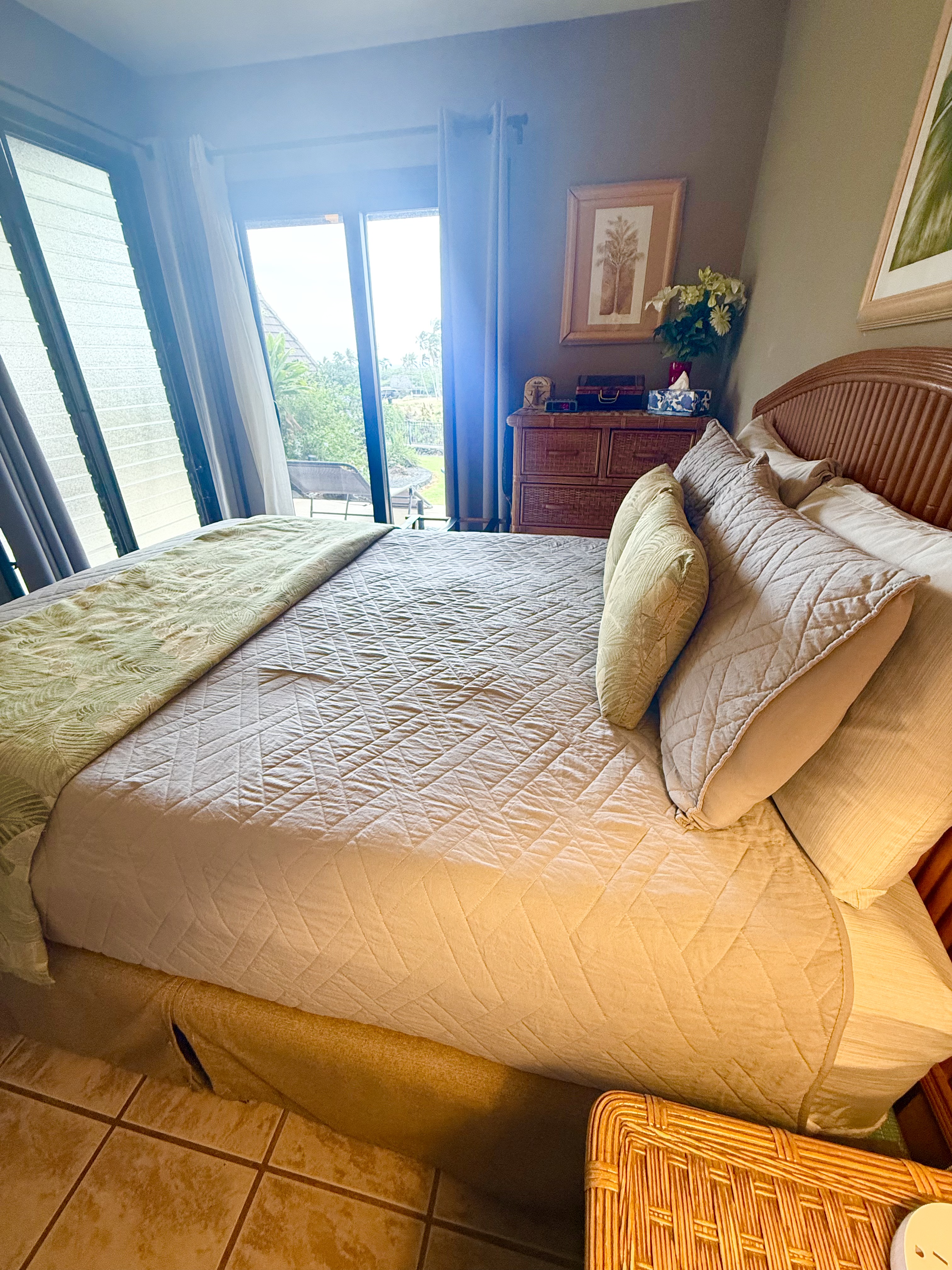 95-788 Ninole Loop Road, Unit 39 Naalehu, HI 96772 - Photo 5 of 15 a bedroom with a bed and wooden floor