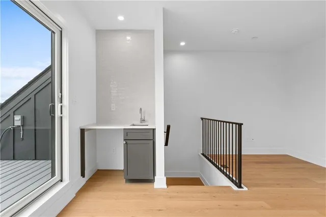 a view of entryway with wooden floor