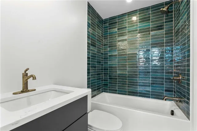 a bathroom with a sink and bathtub