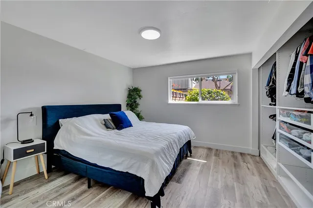 a bedroom with a bed and a book shelf