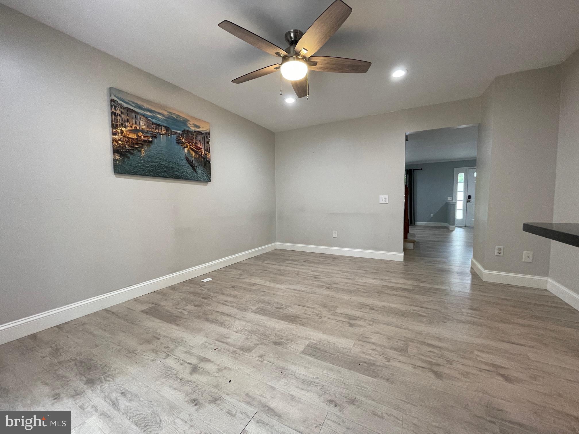 308 Crescendo Way Silver Spring, MD 20901 - Photo 12 of 26 a view of an empty room with window and a ceiling fan