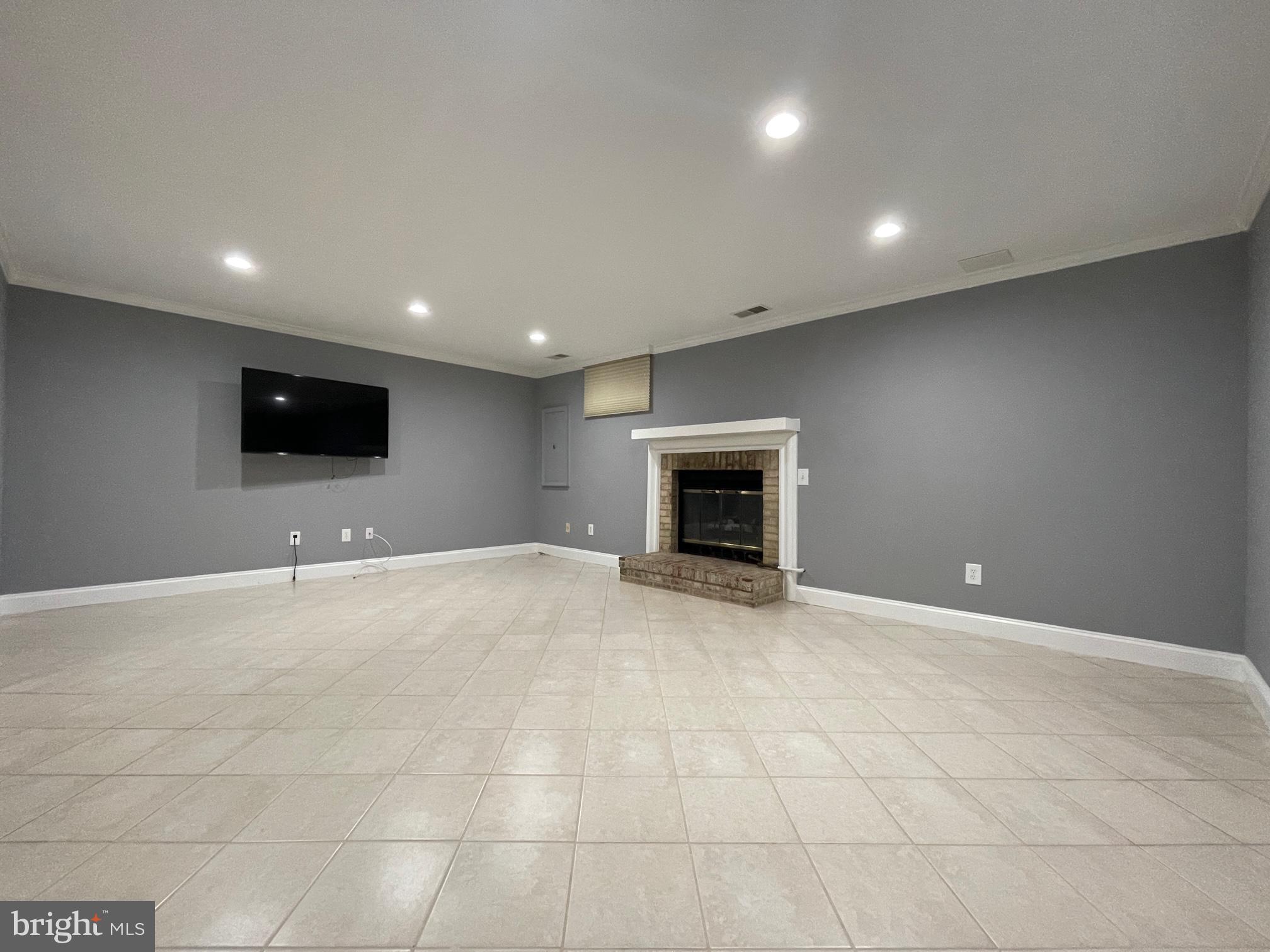 308 Crescendo Way Silver Spring, MD 20901 - Photo 14 of 26 a view of an empty room with a fireplace