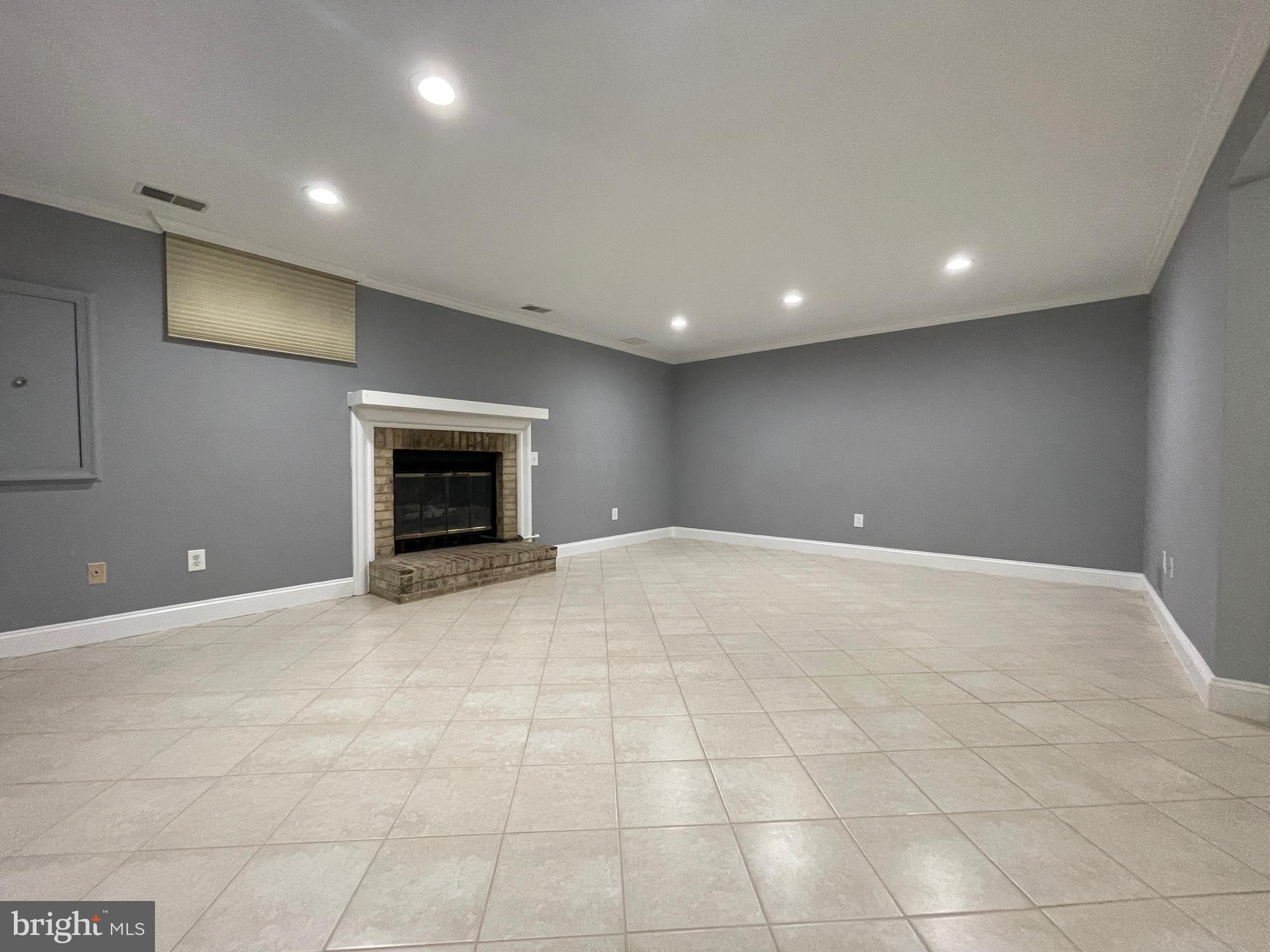 308 Crescendo Way Silver Spring, MD 20901 - Photo 15 of 26 a view of an empty room with a fireplace