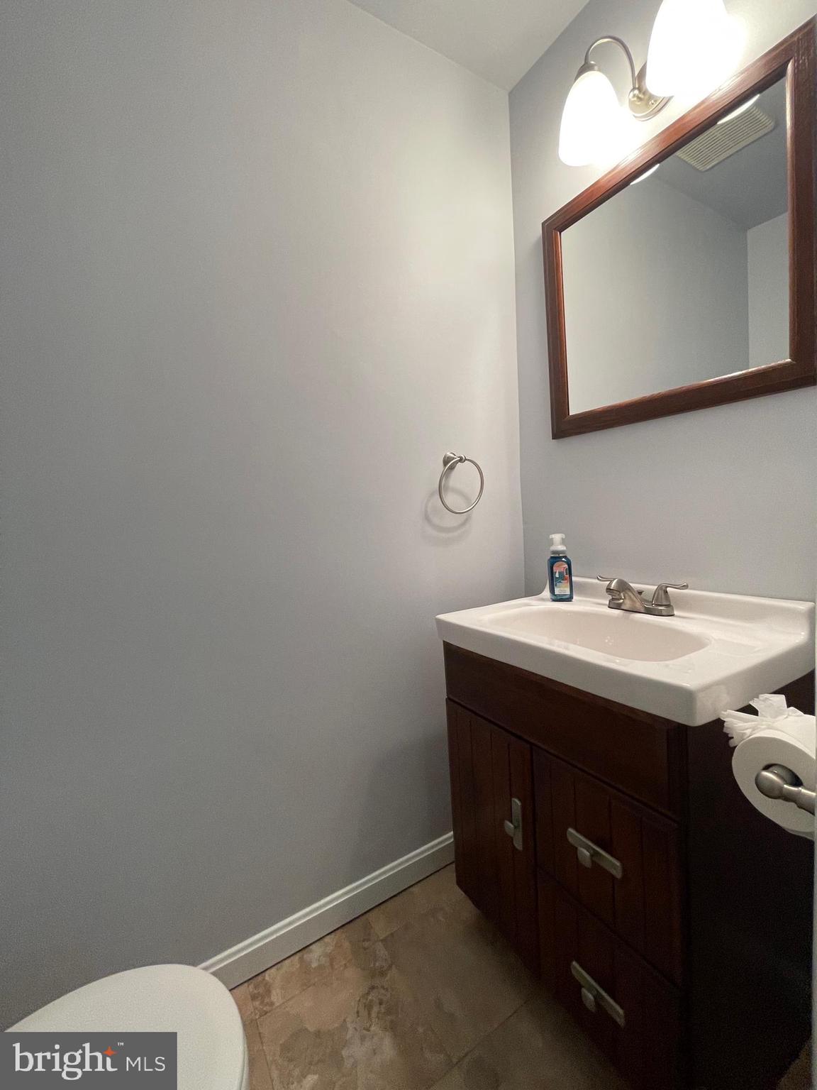 308 Crescendo Way Silver Spring, MD 20901 - Photo 16 of 26 a bathroom with a sink vanity and mirror