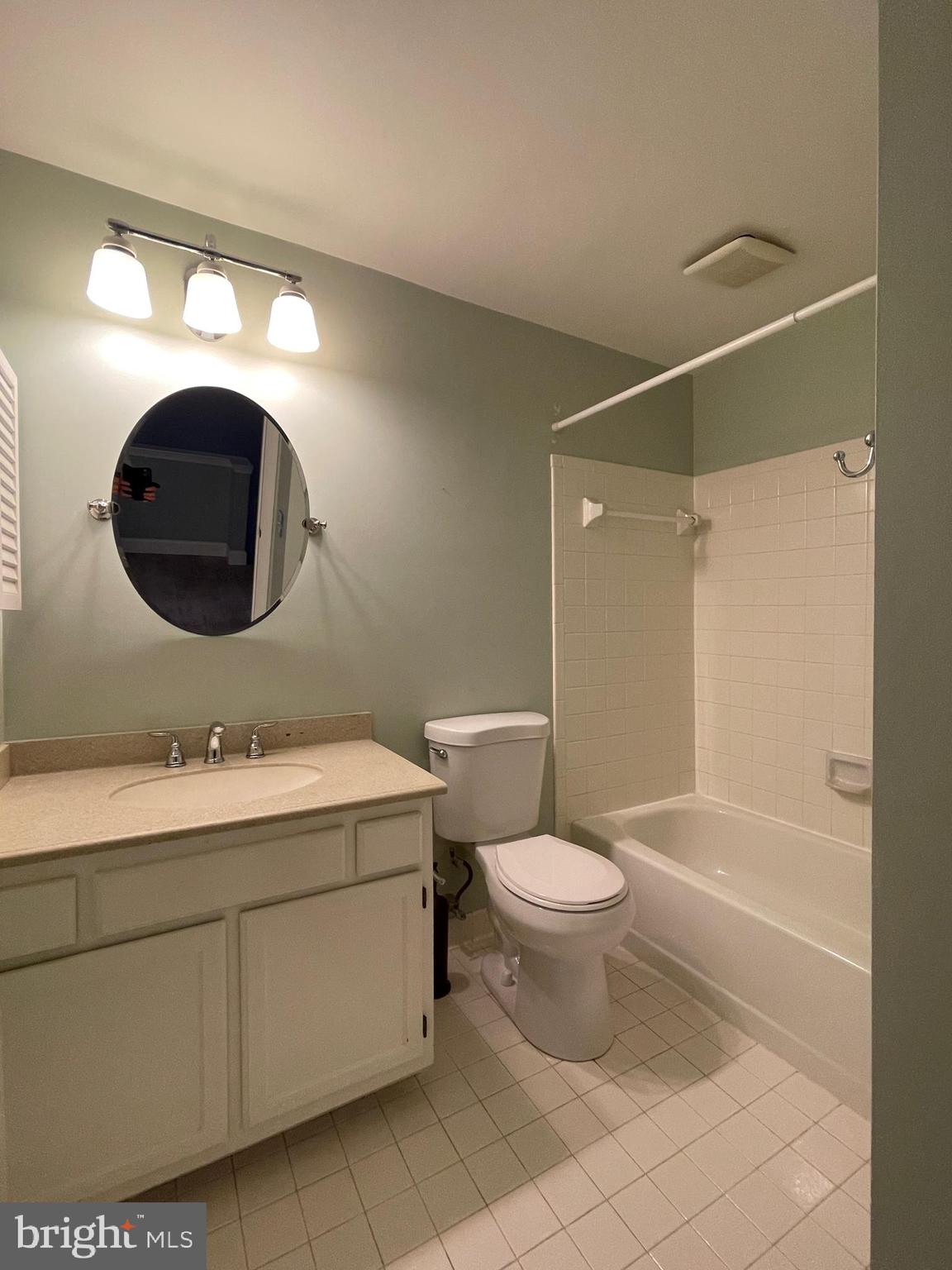 308 Crescendo Way Silver Spring, MD 20901 - Photo 21 of 26 a bathroom with a toilet sink and mirror