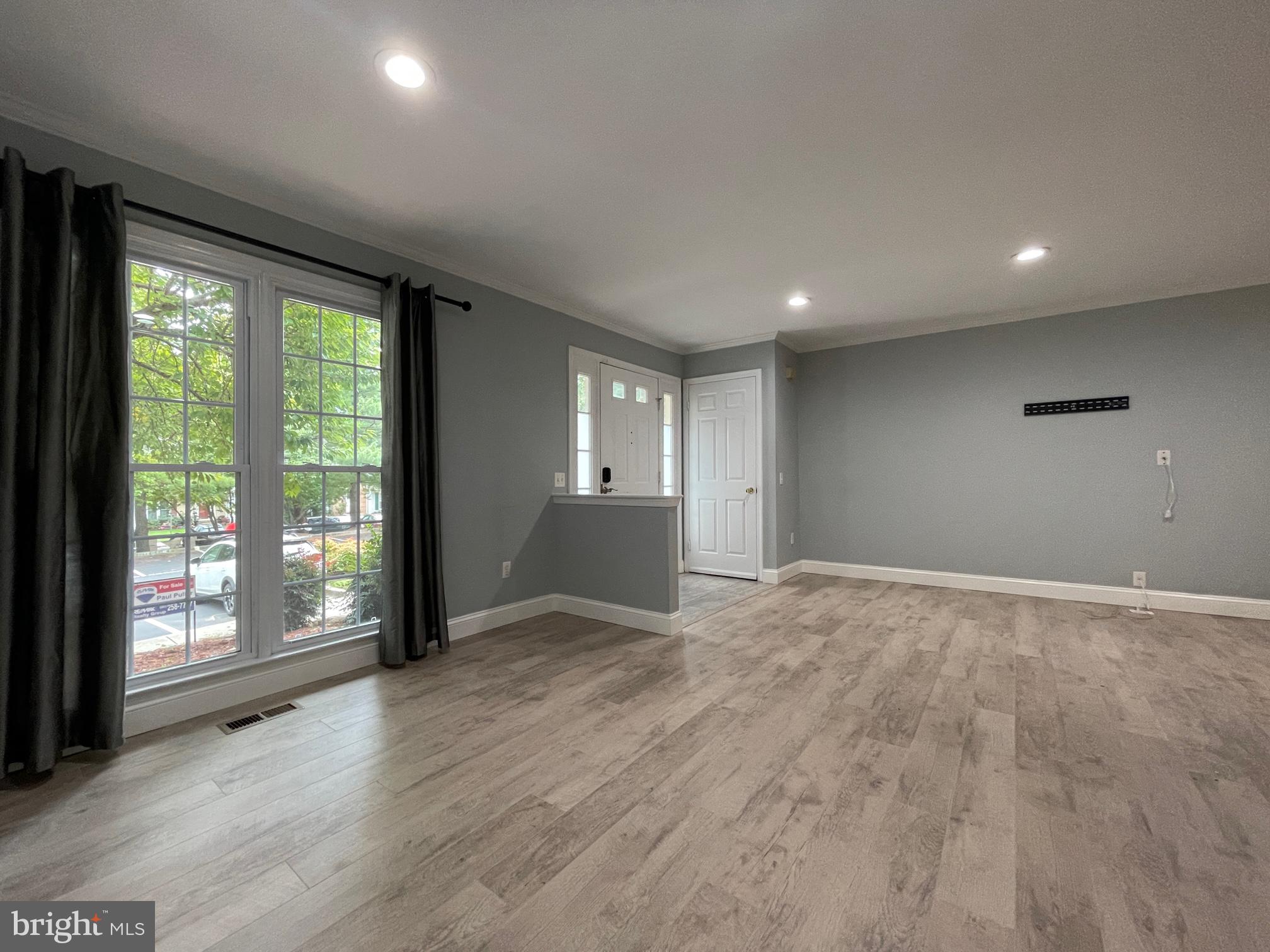 308 Crescendo Way Silver Spring, MD 20901 - Photo 3 of 26 a view of an empty room with a window