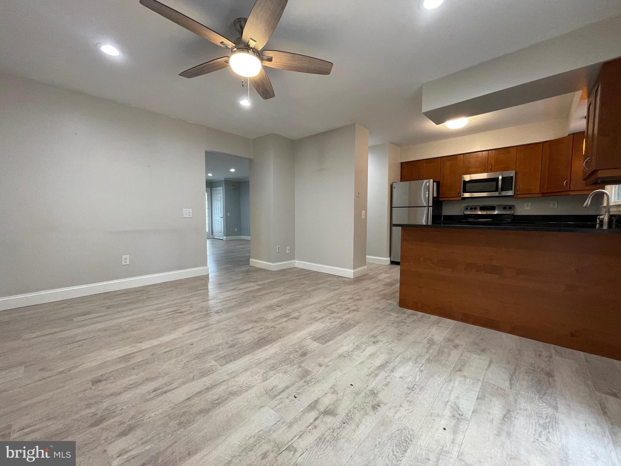 308 Crescendo Way Silver Spring, MD 20901 - Photo 8 of 26 a view of a kitchen with a sink and a microwave