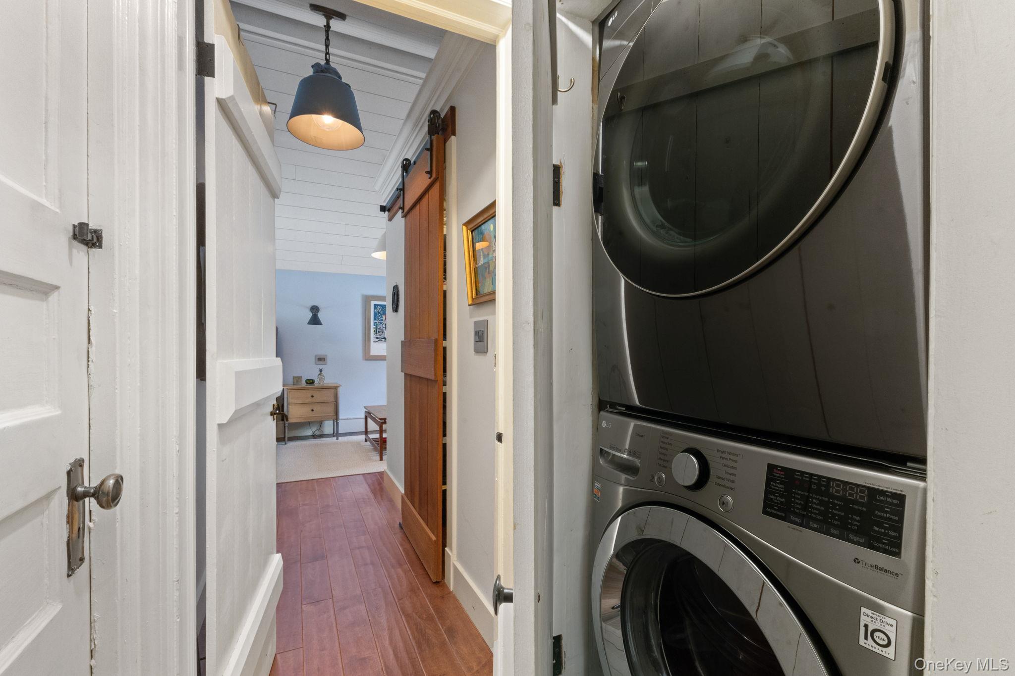 8 South Bedford Road Pound Ridge, NY 10576 - Photo 22 of 32 a view of a bedroom with washer and dryer