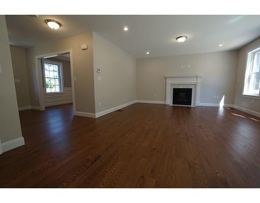 10 Rileys Way Pepperell, MA 01463 - Photo 4 of 7 a view of an empty room with wooden floor and a window
