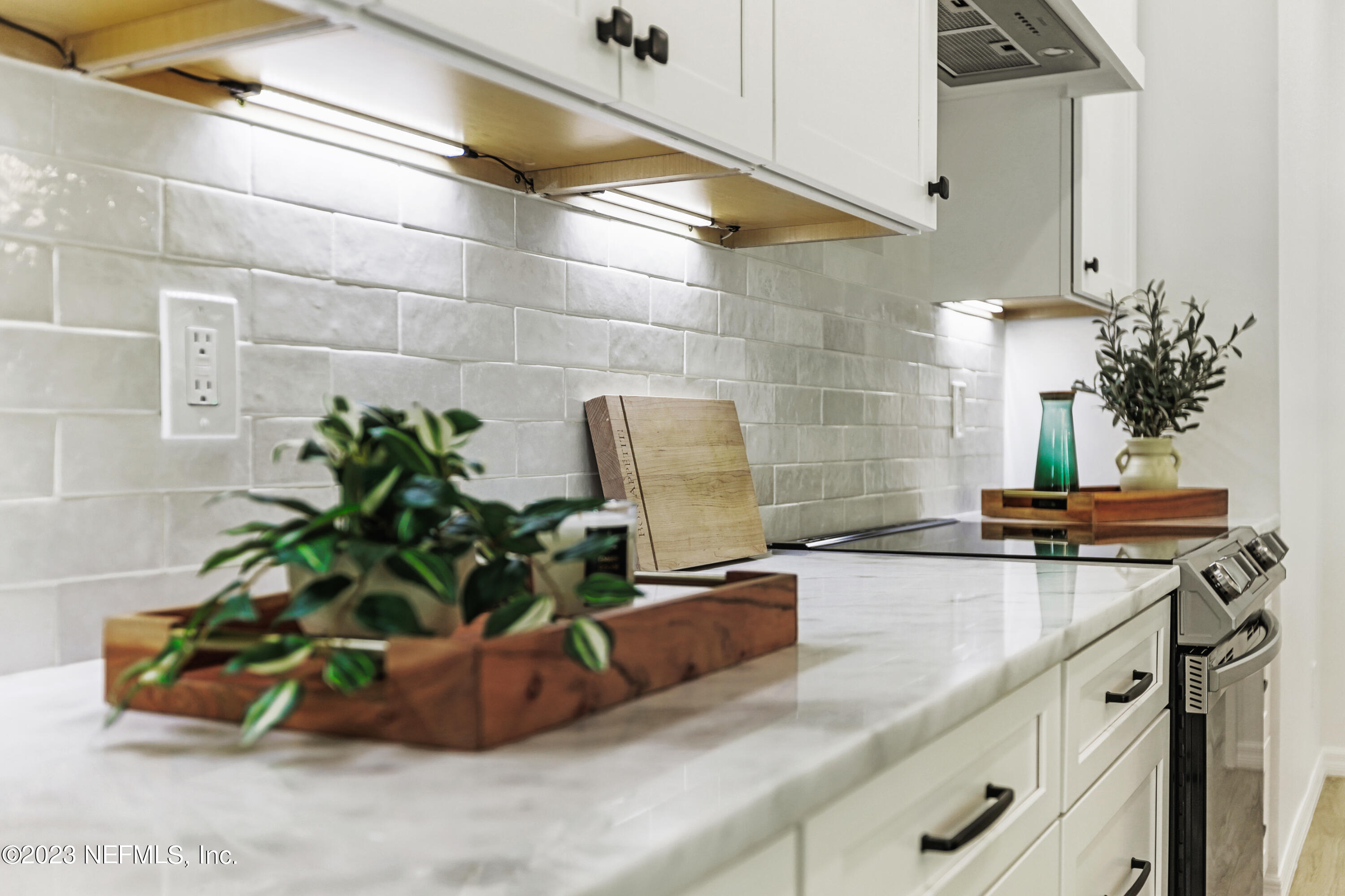627 Cherry Street Neptune Beach, FL 32266 - Photo 17 of 51 a kitchen with a sink and a counter top space