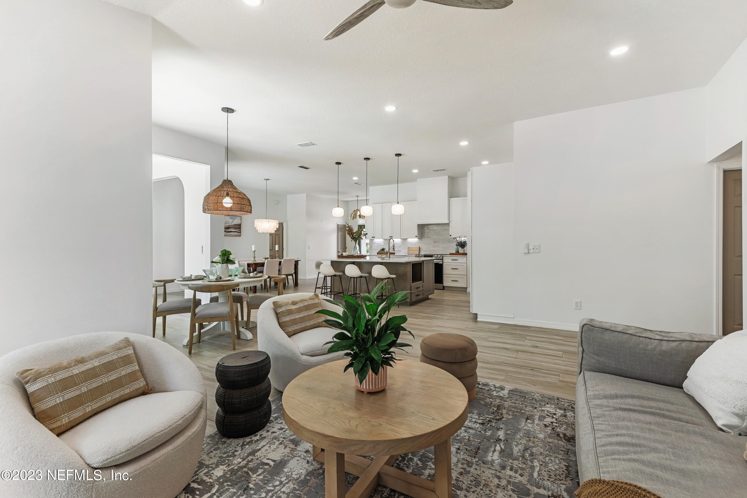 627 Cherry Street Neptune Beach, FL 32266 - Photo 20 of 51 a living room with furniture and a chandelier
