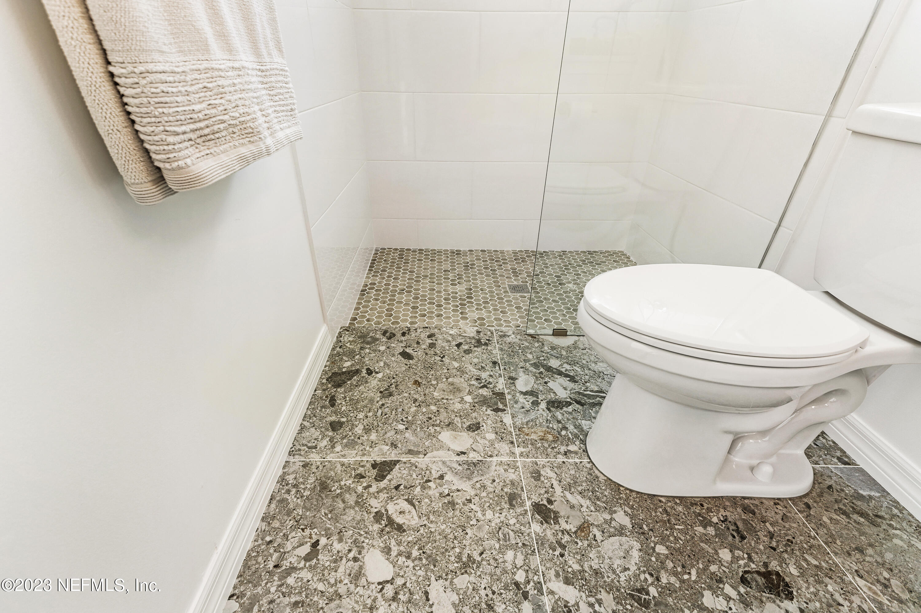 627 Cherry Street Neptune Beach, FL 32266 - Photo 25 of 51 a bathroom with a toilet and a shower