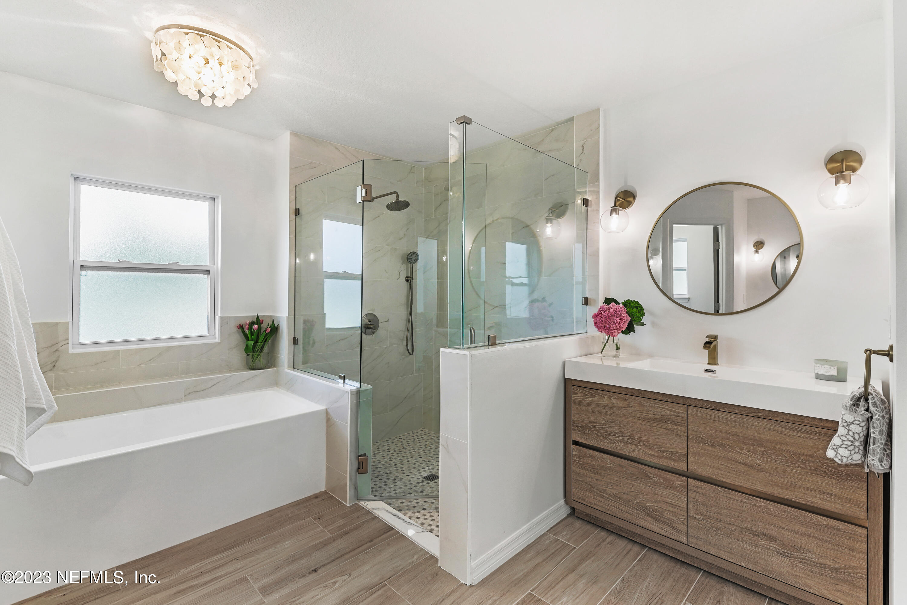 627 Cherry Street Neptune Beach, FL 32266 - Photo 31 of 51 a bathroom with a tub sink and mirror