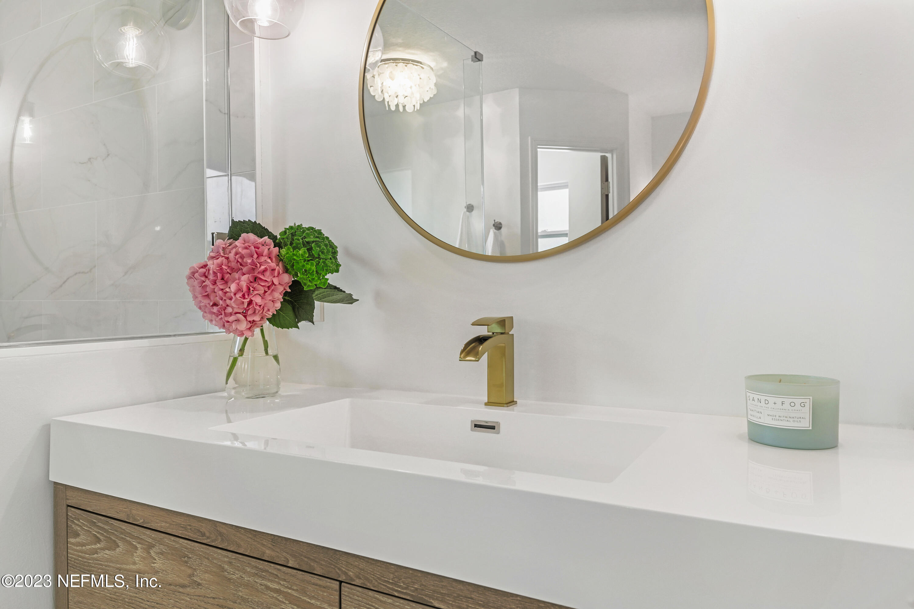 627 Cherry Street Neptune Beach, FL 32266 - Photo 33 of 51 a bathroom with a sink and a mirror