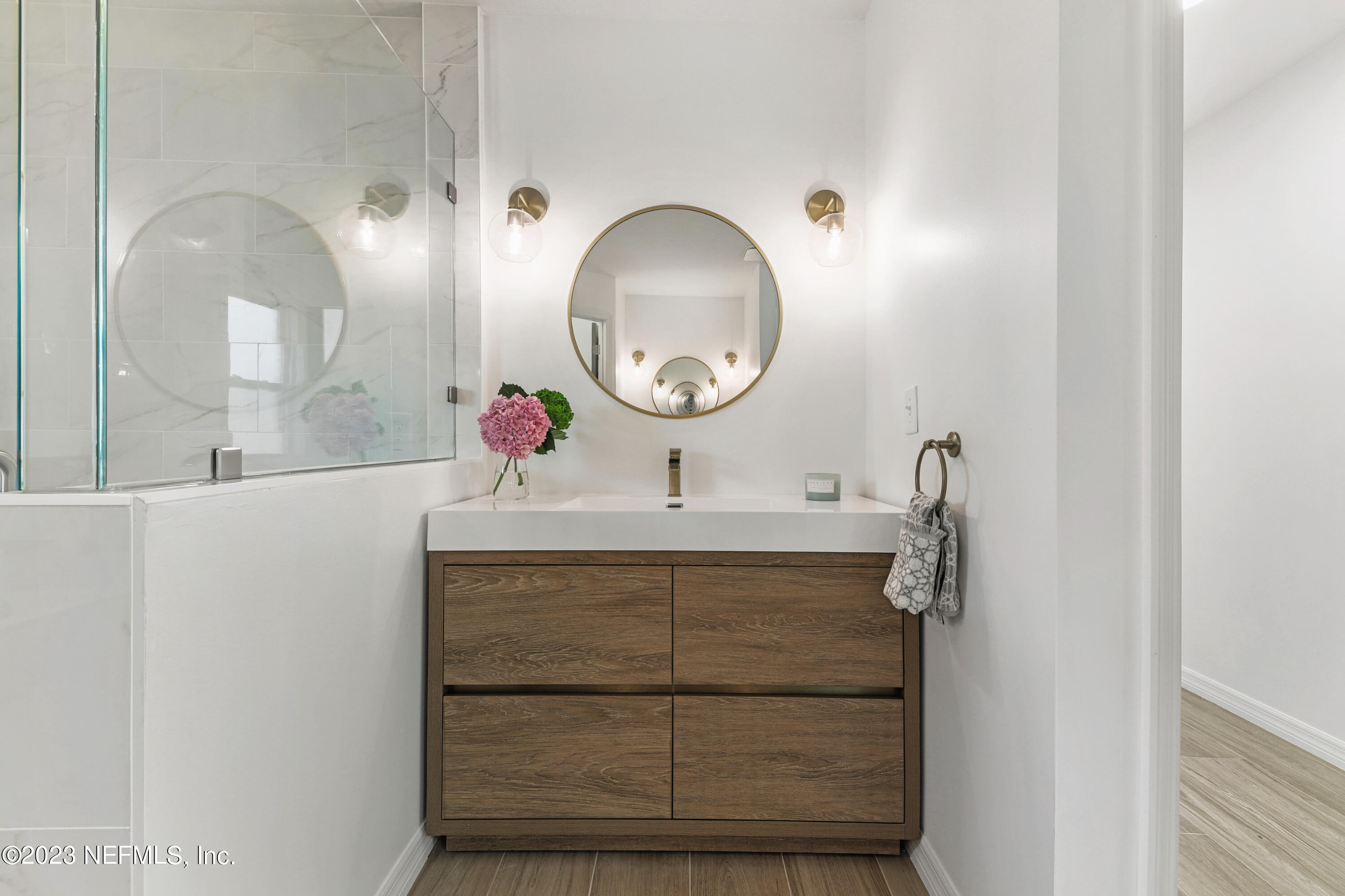 627 Cherry Street Neptune Beach, FL 32266 - Photo 34 of 51 a bathroom with a sink and a mirror