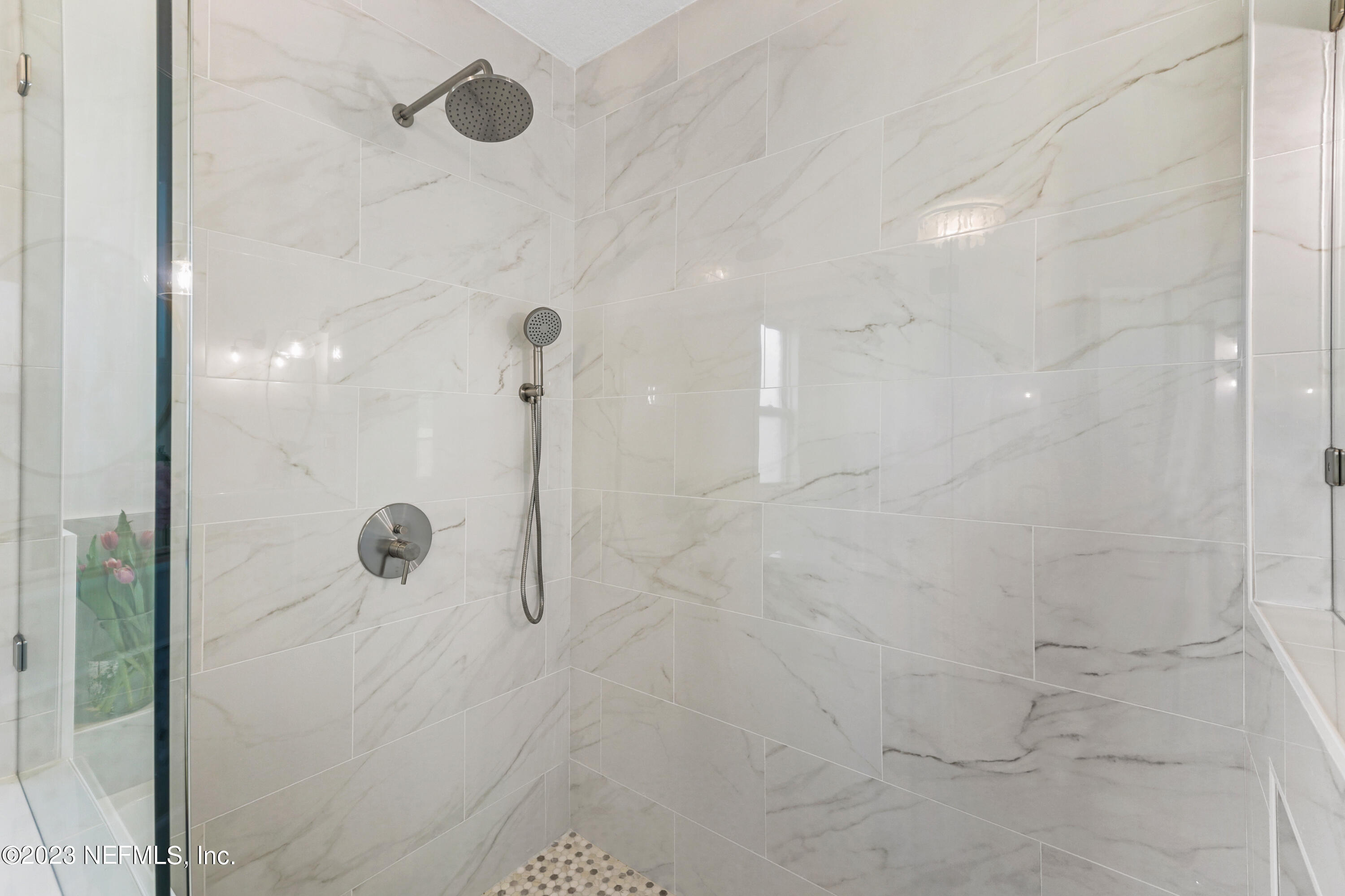 627 Cherry Street Neptune Beach, FL 32266 - Photo 35 of 51 a bathroom with a glass shower door