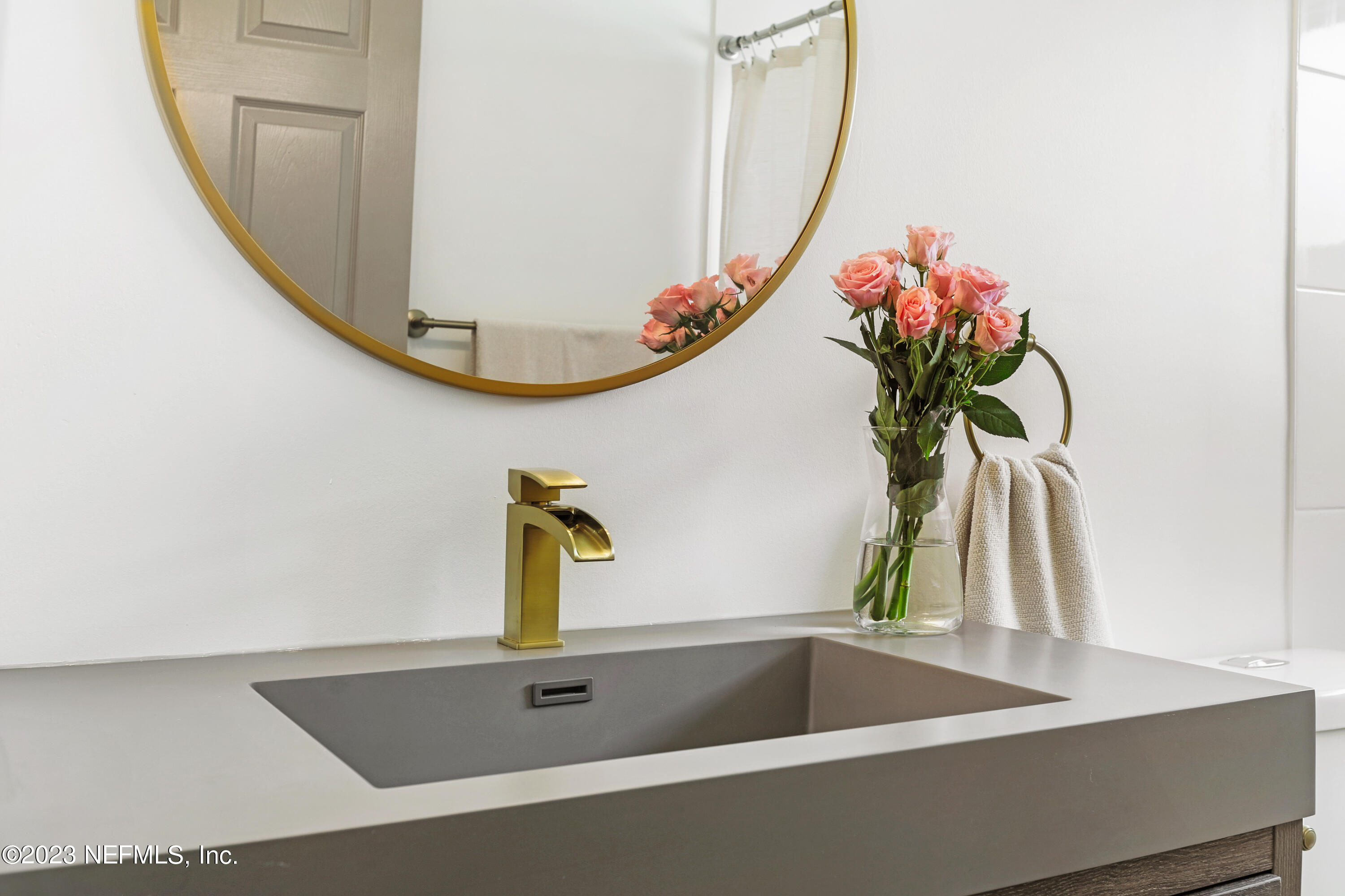 627 Cherry Street Neptune Beach, FL 32266 - Photo 42 of 51 a bathroom with a sink and a mirror
