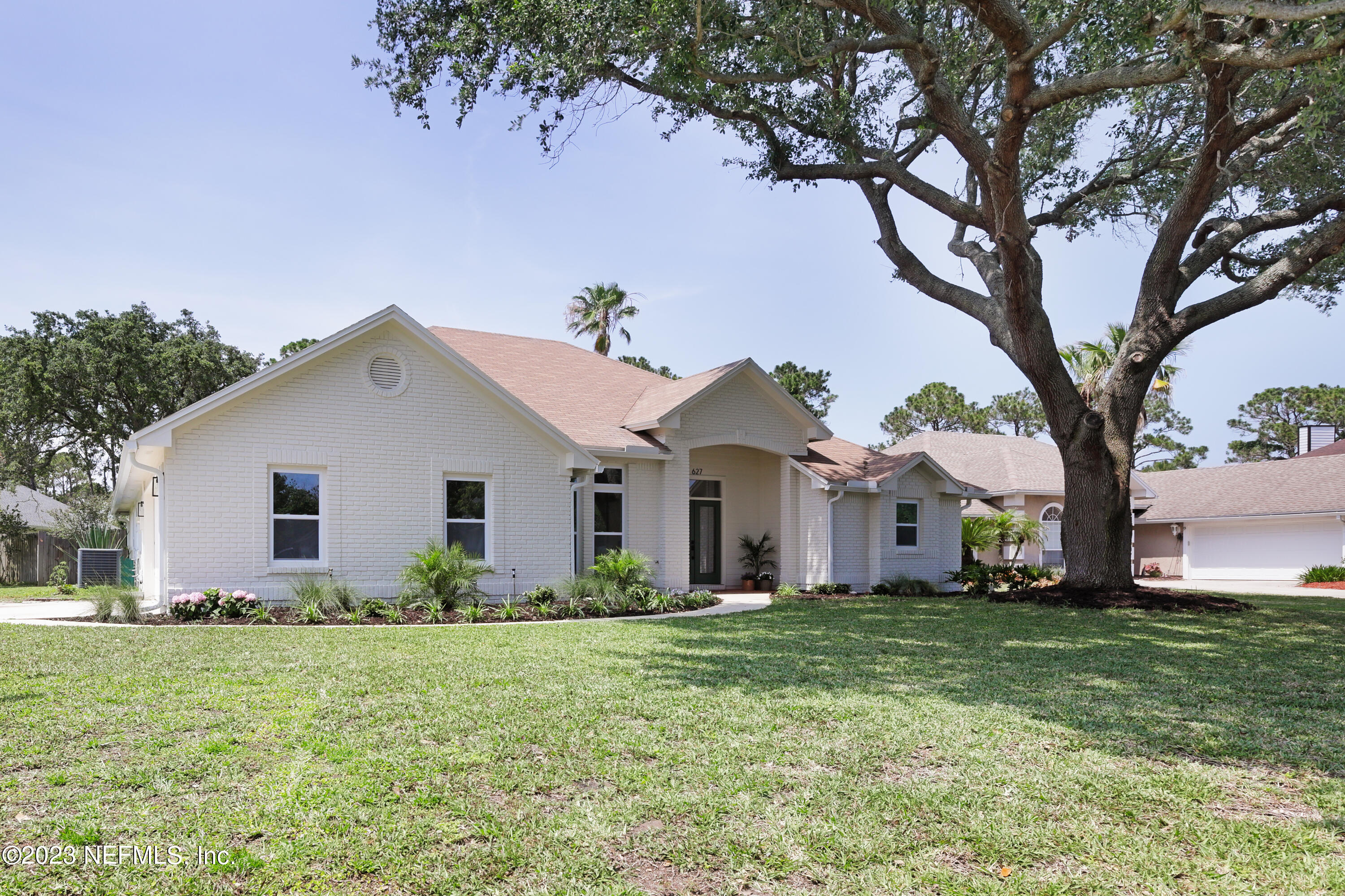 627 Cherry Street Neptune Beach, FL 32266 - Photo 48 of 51 a front view of house with yard and green space