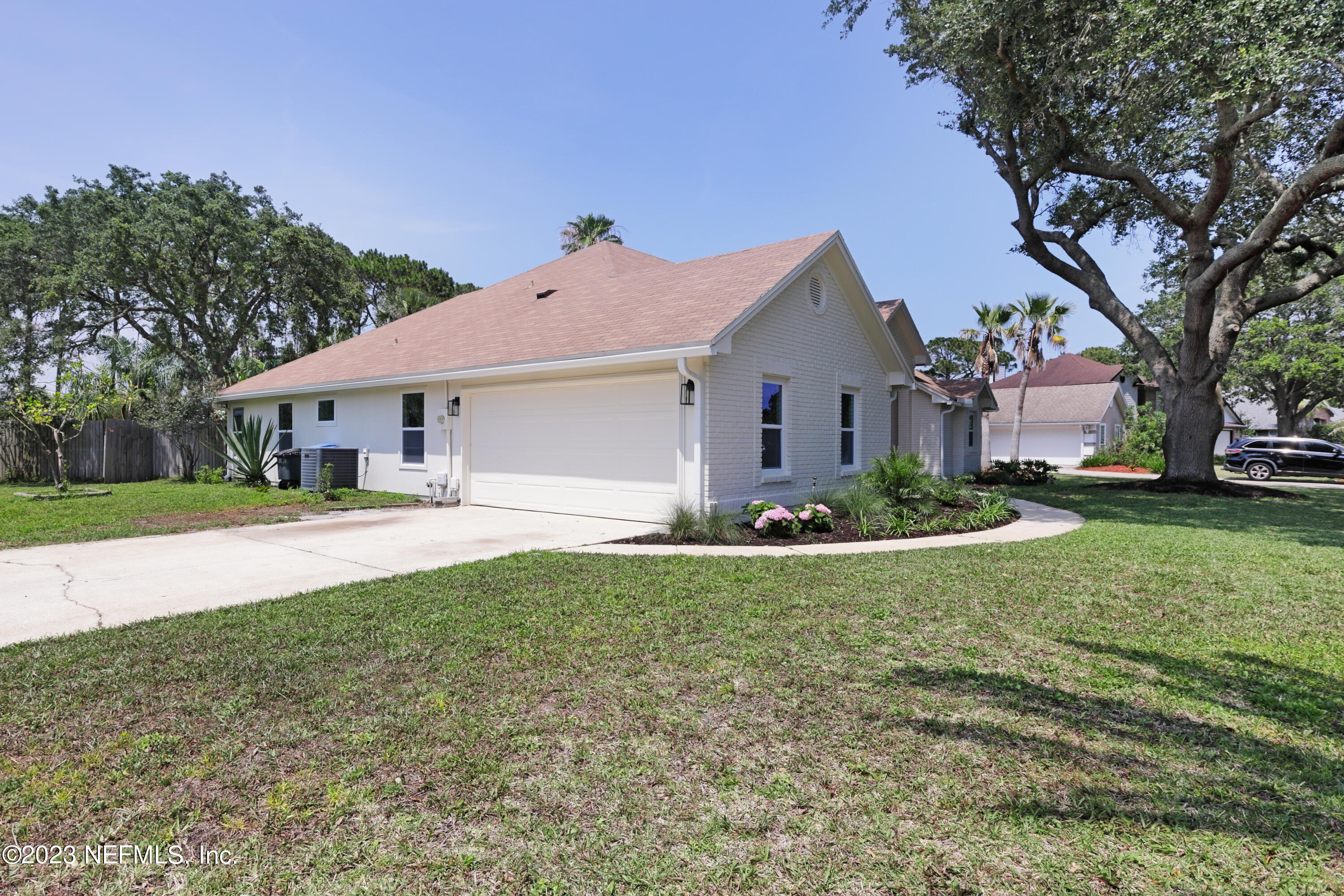 627 Cherry Street Neptune Beach, FL 32266 - Photo 49 of 51 a front view of a house with a yard