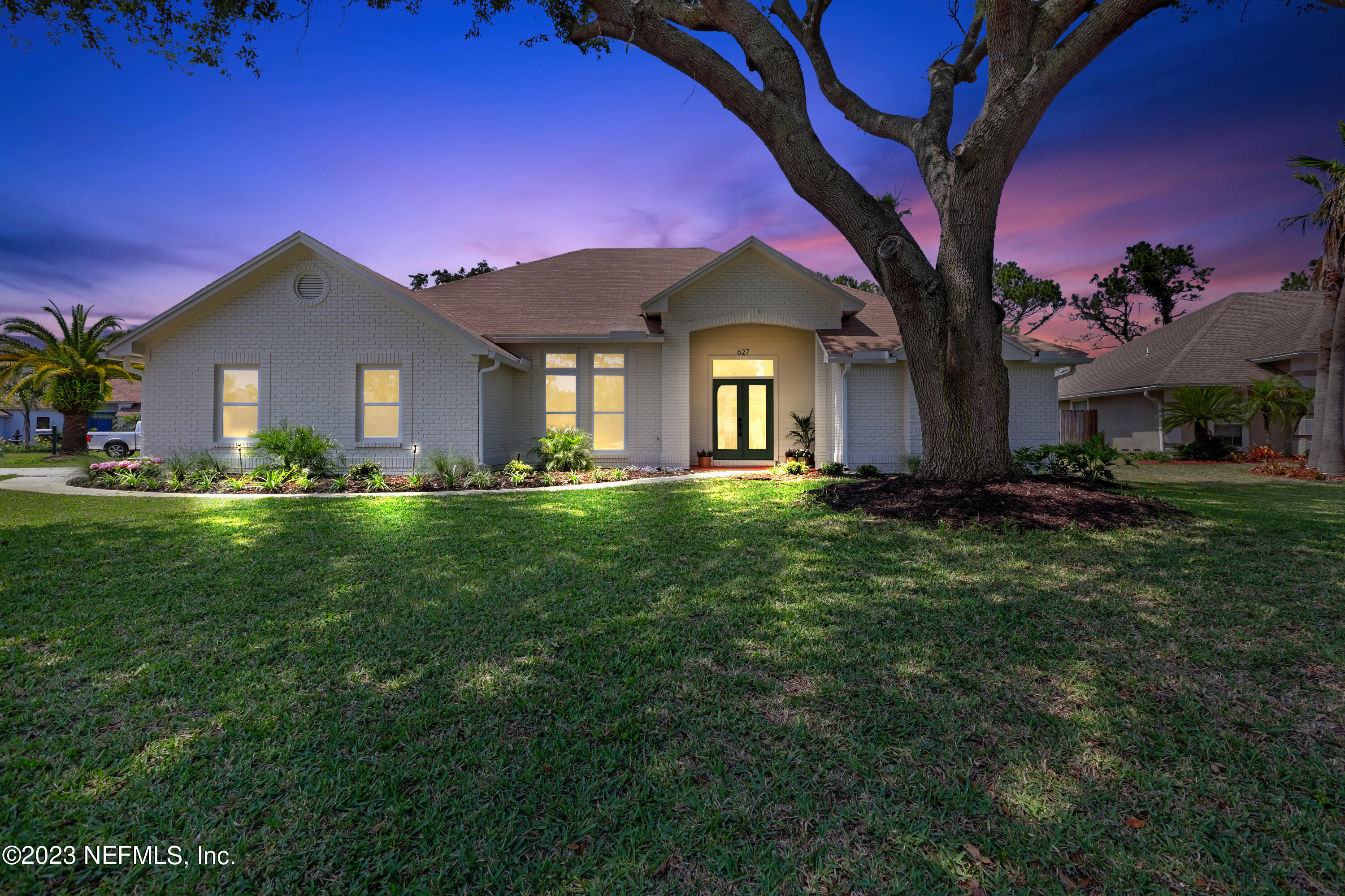 627 Cherry Street Neptune Beach, FL 32266 - Photo 50 of 51 a front view of a house with a yard