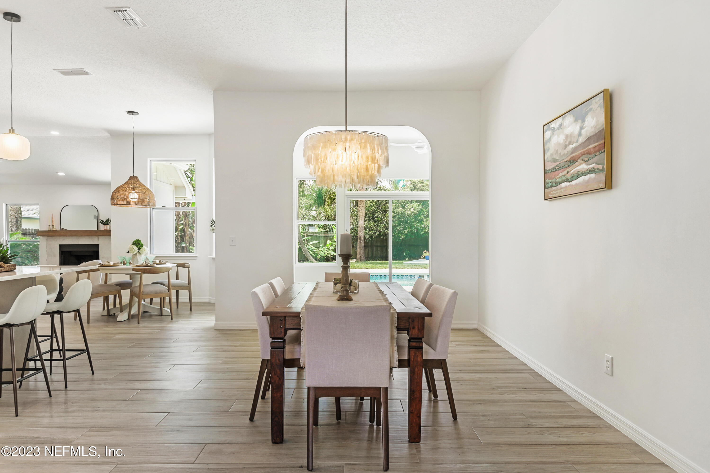 627 Cherry Street Neptune Beach, FL 32266 - Photo 7 of 51 a view of a dining room with furniture window and wooden floor