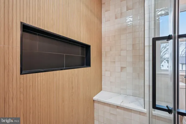 a bathroom with a toilet sink double vanity and mirror