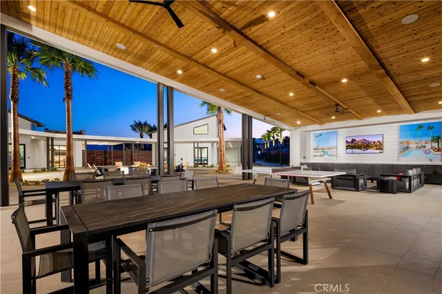 a outdoor dining area with chairs and tables