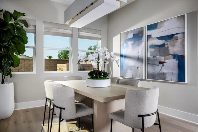 a dining room with furniture and window